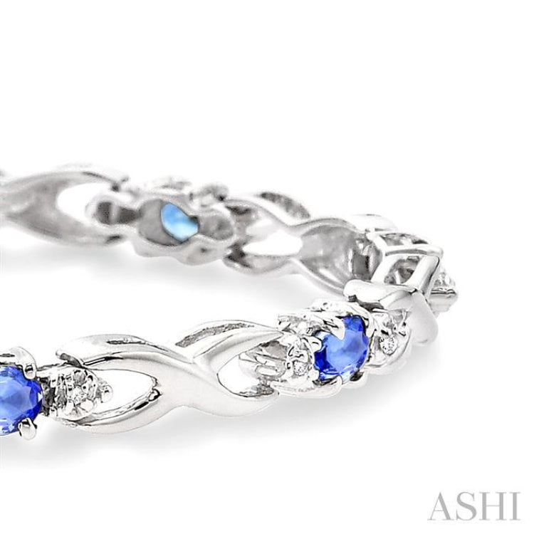 4x3mm Oval Cut Tanzanite and 1/10 Ctw Round Cut Diamond Bracelet in 10K White Gold